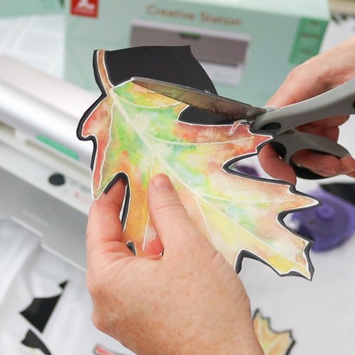 Cutting out watercolor leaf