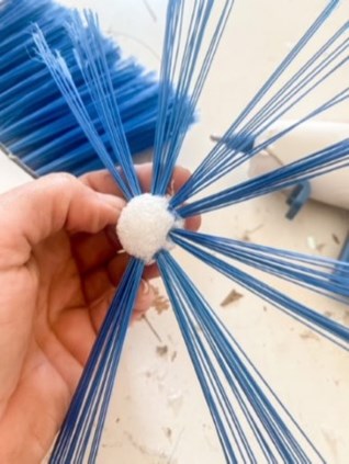 Broom bristles pushed in the Styrofoam ball