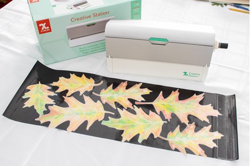 Xyron creative station with laminated sheet of leaves